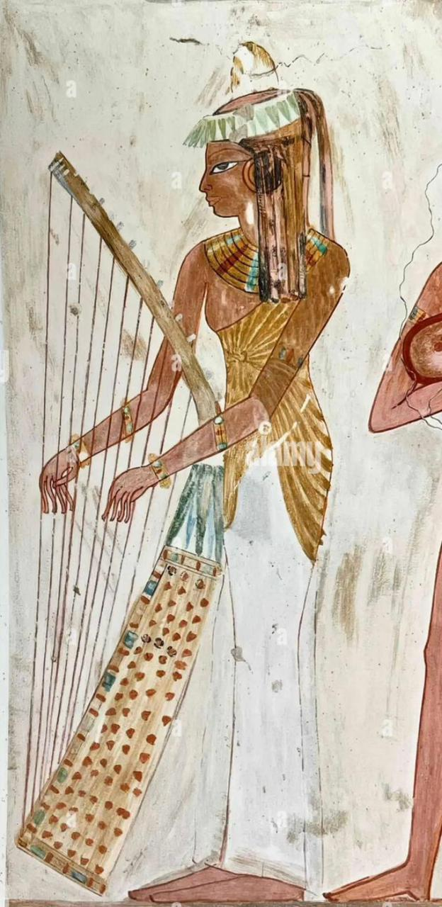 Ancient Egyptian tomb painting of a woman playing a large standing harp
