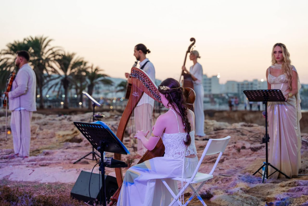The ensemble performing at sunset, another angle